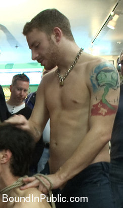 Horny crowd jumps on a ripped stud in a skate shop