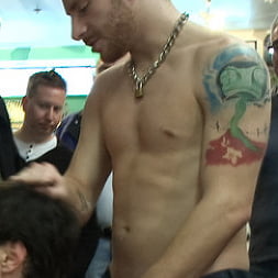 Horny crowd jumps on a ripped stud in a skate shop