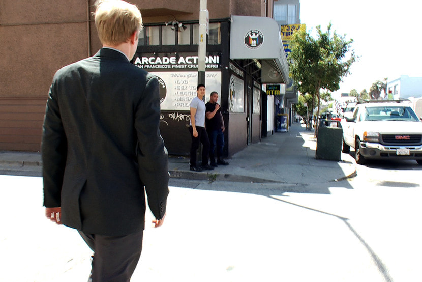 Two thugs drag a businessman into a porn shop and strip him of his manhood.