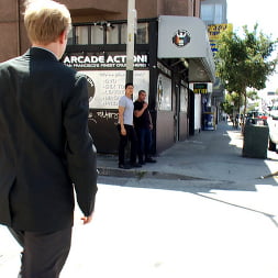 Two thugs drag a businessman into a porn shop and strip him of his manhood.
