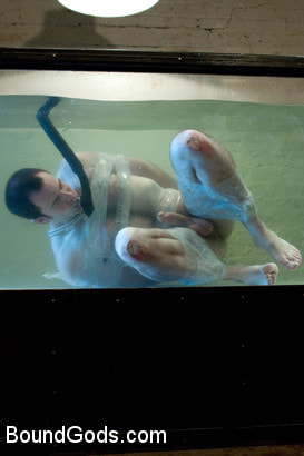 Bound in the sleepsack, submerged under water and made to cum.