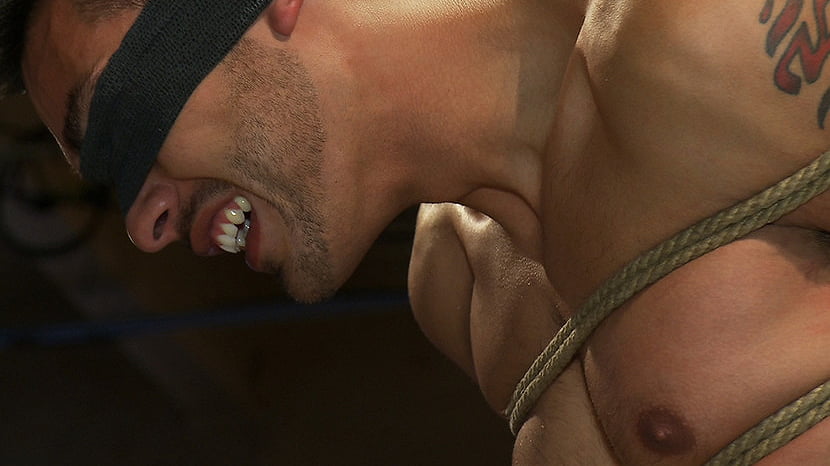 Blindfolded stud sucks strangers cocks at a party.