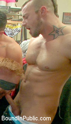 Muscled stud worships feet and takes cock after cock in bondage