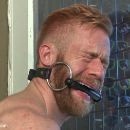 Muscled stud worships feet and takes cock after cock in bondage