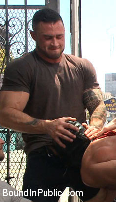 Muscled whore gets publicly fucked and doused with cum