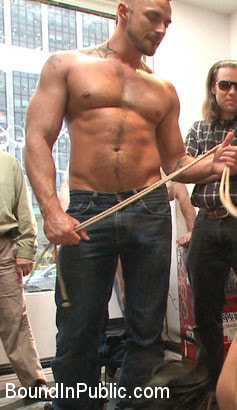 Muscled whore gets publicly fucked and doused with cum