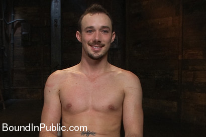 Stud in a metal cage is fucked by horny bar patrons