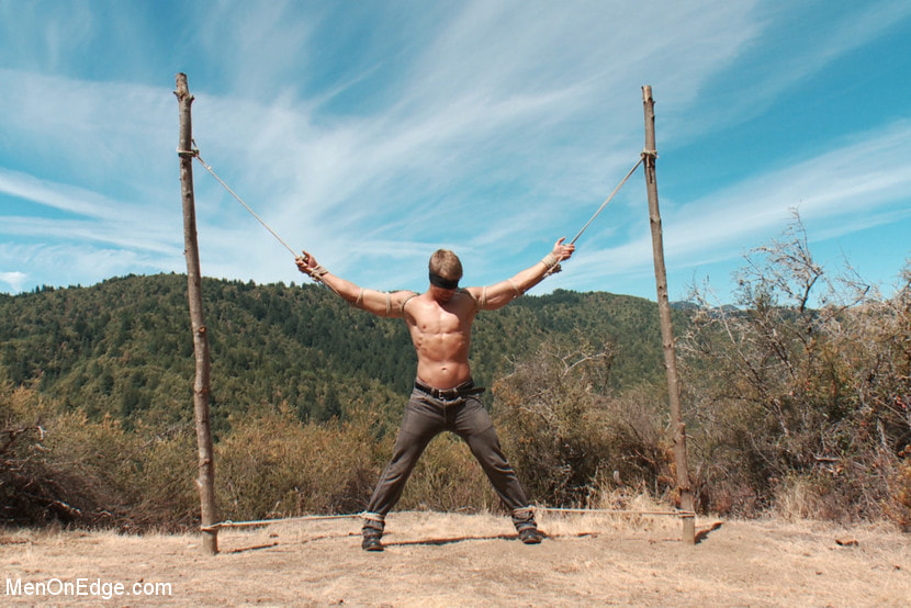 Captured straight jock gets his tight ass violated in the deep woods