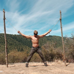 Captured straight jock gets his tight ass violated in the deep woods