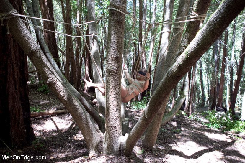 Captured straight jock gets his tight ass violated in the deep woods