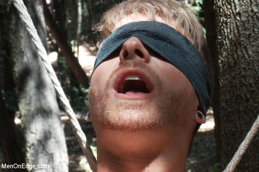 Captured straight jock gets his tight ass violated in the deep woods