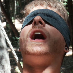 Captured straight jock gets his tight ass violated in the deep woods