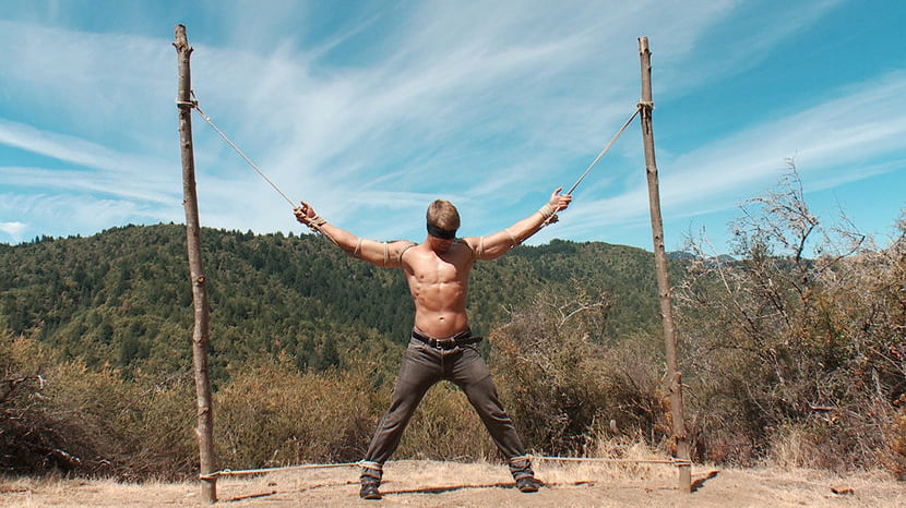 Captured straight jock gets his tight ass violated in the deep woods