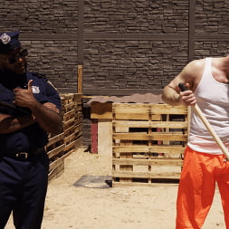 Good Behavior: Inmate Joseph Ox Submits to Officer Micah Martinez