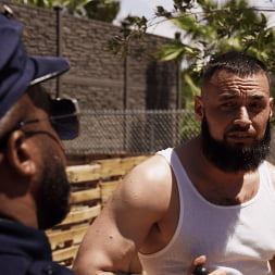 Good Behavior: Inmate Joseph Ox Submits to Officer Micah Martinez