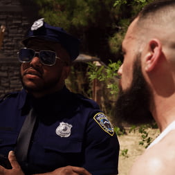 Good Behavior: Inmate Joseph Ox Submits to Officer Micah Martinez