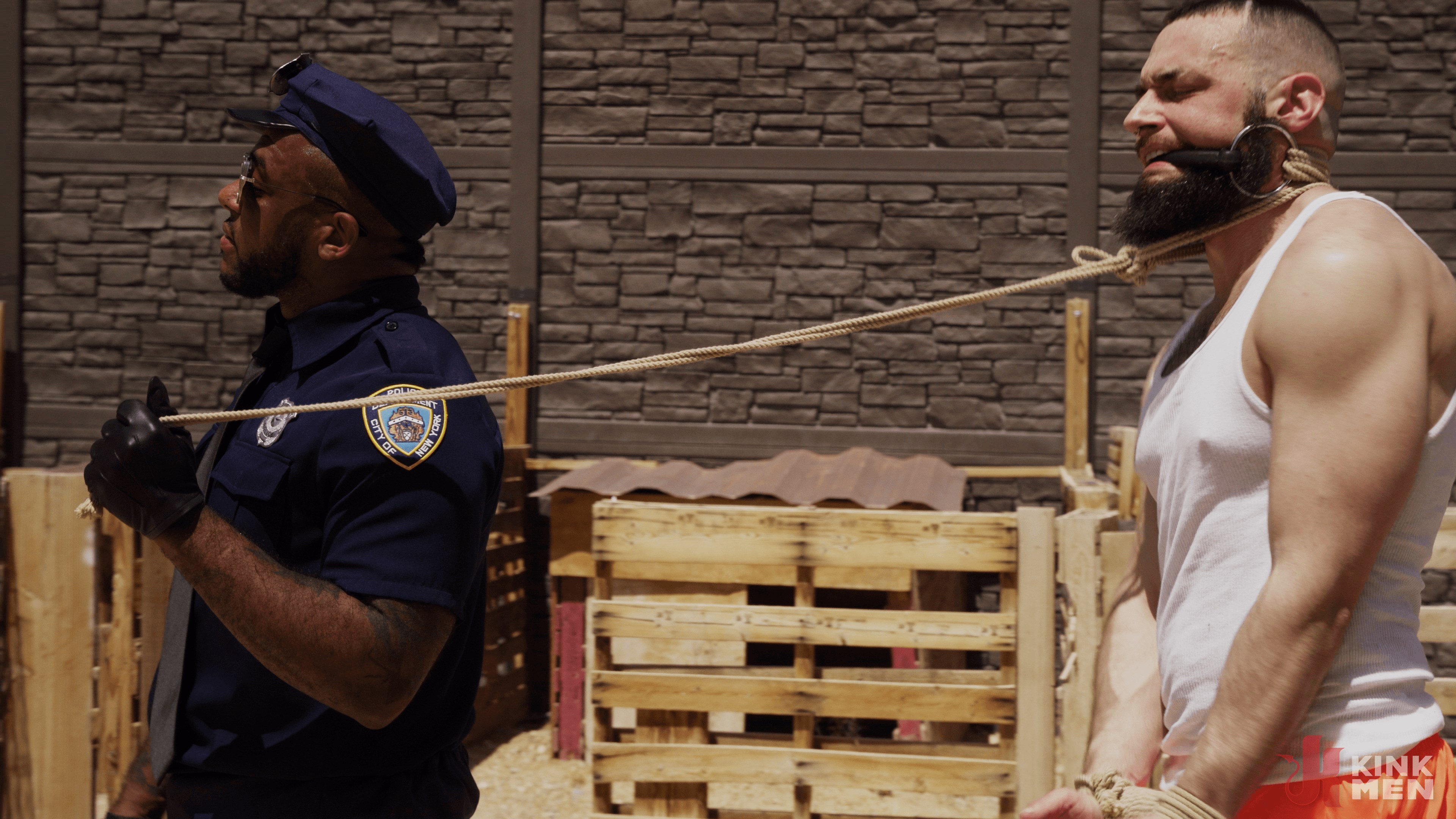 Good Behavior: Inmate Joseph Ox Submits to Officer Micah Martinez