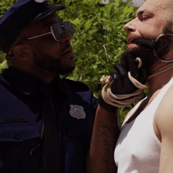 Good Behavior: Inmate Joseph Ox Submits to Officer Micah Martinez
