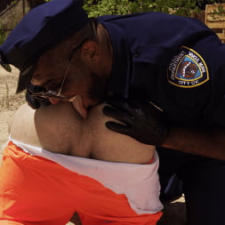 Good Behavior: Inmate Joseph Ox Submits to Officer Micah Martinez
