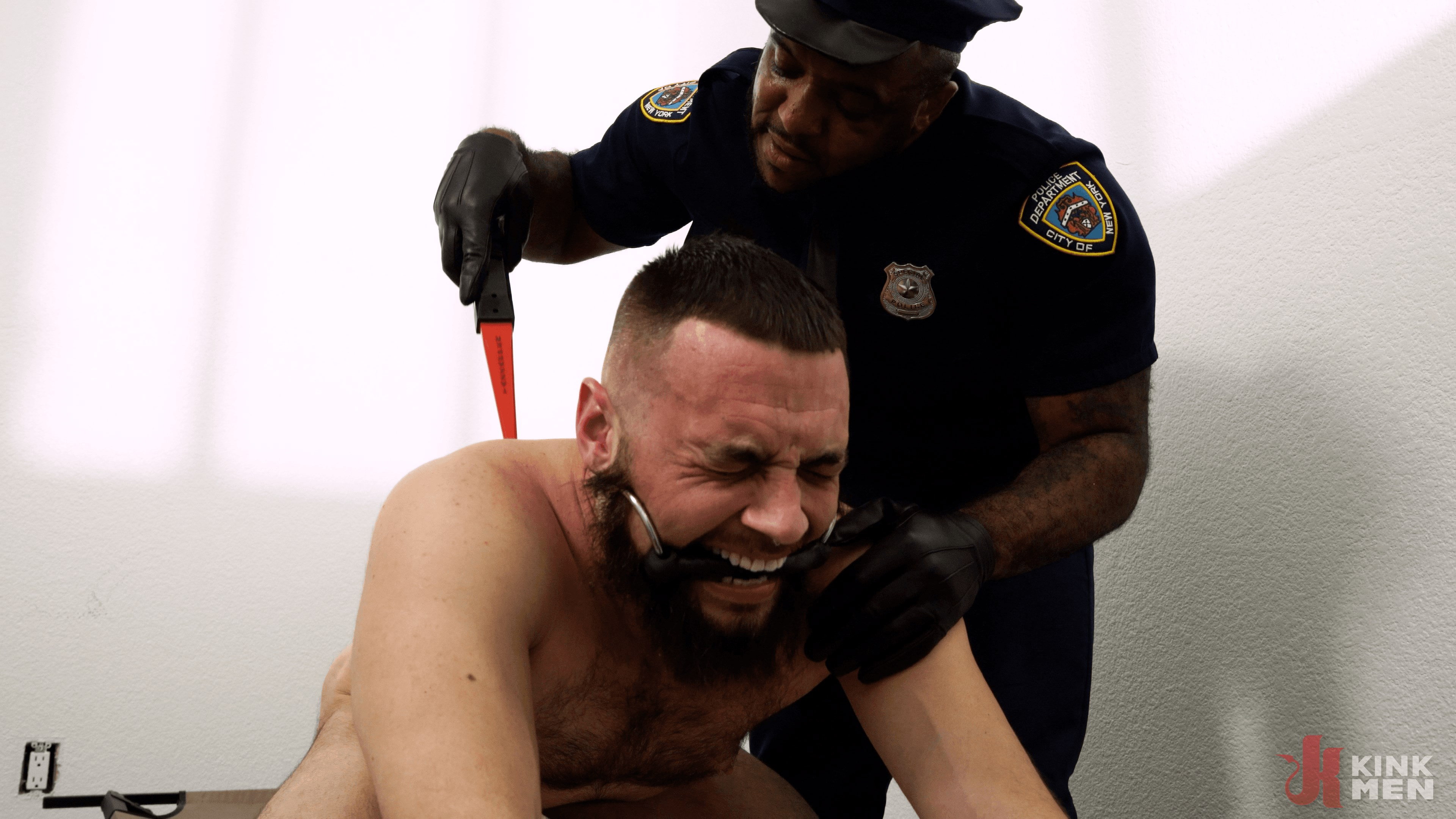 Good Behavior: Inmate Joseph Ox Submits to Officer Micah Martinez