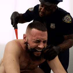 Good Behavior: Inmate Joseph Ox Submits to Officer Micah Martinez