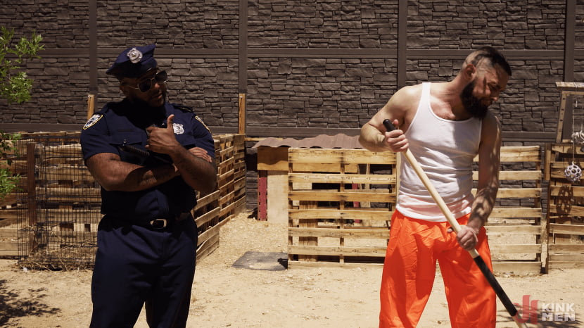 Good Behavior: Inmate Joseph Ox Submits to Officer Micah Martinez